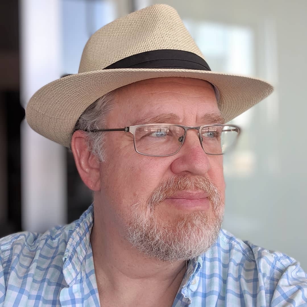 Photo of Nikolai Lokteff, voice actor, wearing a panama hat